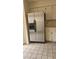 A kitchen showcasing stainless steel refrigerator and tile flooring at 706 Lighthouse Ct, Altamonte Springs, FL 32714