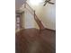 Open living room features staircase and wood floors adjoining tiled entry at 706 Lighthouse Ct, Altamonte Springs, FL 32714