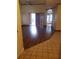 Bright living room boasts wood floors and sliding glass doors leading to the outdoors at 706 Lighthouse Ct, Altamonte Springs, FL 32714
