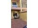 Brick patio with outdoor couch, window, and wood accents on second-story balcony at 706 Lighthouse Ct, Altamonte Springs, FL 32714