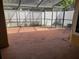 Screened patio with red brick flooring and white privacy fence at 706 Lighthouse Ct, Altamonte Springs, FL 32714