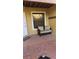 Brick patio with an outdoor couch, window, and white door, perfect for relaxing at 706 Lighthouse Ct, Altamonte Springs, FL 32714