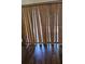 Interior image featuring a window with wood blinds and wood flooring at 706 Lighthouse Ct, Altamonte Springs, FL 32714