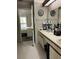 Bathroom with double sinks, a long countertop, and storage to keep items organized at 707 Carpenters Way # 50, Lakeland, FL 33809