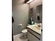 Bathroom featuring vanity with sink, mirror and toilet with tile flooring at 707 Carpenters Way # 50, Lakeland, FL 33809
