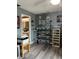 Bedroom with a ceiling fan and a desk, and stacked storage bins and shelves with various decor at 707 Carpenters Way # 50, Lakeland, FL 33809
