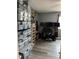 Bedroom with a ceiling fan and a desk, and stacked storage bins and shelves with various decor at 707 Carpenters Way # 50, Lakeland, FL 33809