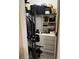 Walk-in closet with plenty of hanging and shelf storage, as well as exercise equipment at 707 Carpenters Way # 50, Lakeland, FL 33809
