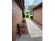 Exterior of building showing mulch landscaping with green shrubbery and concrete walkway at 707 Carpenters Way # 50, Lakeland, FL 33809