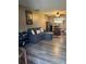 Inviting living room with a comfortable sofa, wood flooring, and open layout at 707 Carpenters Way # 50, Lakeland, FL 33809