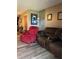 Comfortable living room featuring recliner seating and neutral-toned walls at 707 Carpenters Way # 50, Lakeland, FL 33809
