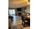 Bright living room with fireplace, tv and sliding glass door to the outside at 707 Carpenters Way # 50, Lakeland, FL 33809