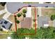 Aerial view of property with red outline, showing the property line and neighboring homes at 809 Deer Glen Ct, Fruitland Park, FL 34731