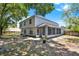 Large, fenced backyard with ample room to run and a screened-in patio at 809 Deer Glen Ct, Fruitland Park, FL 34731