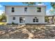 Open backyard showing rear exterior featuring a sliding glass door and screened-in patio at 809 Deer Glen Ct, Fruitland Park, FL 34731