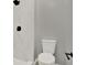 Updated bathroom features white marble shower with black fixtures and neutral wall color at 809 Deer Glen Ct, Fruitland Park, FL 34731