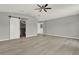 Expansive bedroom featuring a ceiling fan and a doorway to the ensuite bathroom at 809 Deer Glen Ct, Fruitland Park, FL 34731