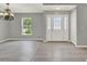 View of entryway that features gray walls, light hardwood floors, and white trim at 809 Deer Glen Ct, Fruitland Park, FL 34731