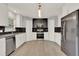 Modern kitchen featuring stainless steel appliances and stylish backsplash at 809 Deer Glen Ct, Fruitland Park, FL 34731