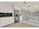 Remodeled kitchen with modern appliances and light fixtures at 809 Deer Glen Ct, Fruitland Park, FL 34731