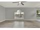 A light-filled living room featuring a backyard view at 809 Deer Glen Ct, Fruitland Park, FL 34731