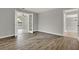 Spacious living room features gray walls and hardwood floors at 809 Deer Glen Ct, Fruitland Park, FL 34731
