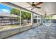 Relaxing screened patio with large tile flooring and a great view of the backyard at 809 Deer Glen Ct, Fruitland Park, FL 34731