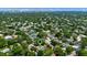 Aerial view of neighborhood near Orlando Eye and Restaurant Row, with lush greenery and a mix of homes at 8655 Shady Glen Dr, Orlando, FL 32819