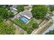 Aerial view of a home with a screened-in pool at 8655 Shady Glen Dr, Orlando, FL 32819