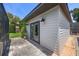Exterior view of outbuilding with a pair of glass doors at 8655 Shady Glen Dr, Orlando, FL 32819