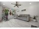 Flex space with a gray sofa, a home gym, and neutral walls and flooring at 8655 Shady Glen Dr, Orlando, FL 32819