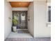 Inviting front entry with a double door, decorative wreaths, and a cozy, covered porch at 8655 Shady Glen Dr, Orlando, FL 32819