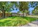 Charming home with mature trees, lush landscaping, and a welcoming front entrance at 8655 Shady Glen Dr, Orlando, FL 32819