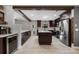 Spacious open kitchen with stainless steel appliances and a dark wooden island at 8655 Shady Glen Dr, Orlando, FL 32819