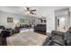 Living room featuring sleek hardwood floors and glass slider doors offering abundant natural light and outdoor views at 8655 Shady Glen Dr, Orlando, FL 32819
