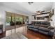 Living room with kitchen and outdoor patio view, sliding glass doors and comfortable seating at 8655 Shady Glen Dr, Orlando, FL 32819