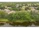 Community homes nestled around a scenic lake at 9644 Myrtle Creek Ln, Orlando, FL 32832