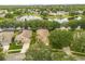 Aerial view showcasing homes on a verdant lot at 9644 Myrtle Creek Ln, Orlando, FL 32832