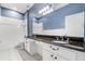 Bathroom featuring soaking tub with shower and large double sink vanity with granite counters at 9644 Myrtle Creek Ln, Orlando, FL 32832