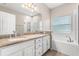 Bathroom with double sinks, tub and tiled shower at 9644 Myrtle Creek Ln, Orlando, FL 32832