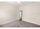 Neutral bedroom with standard closet, neutral carpet and view to the outdoors at 9644 Myrtle Creek Ln, Orlando, FL 32832