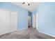 Bedroom featuring carpet and a double closet at 9644 Myrtle Creek Ln, Orlando, FL 32832