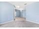 Spacious entryway showcasing tile and carpet flooring with an elegant chandelier lighting the open space at 9644 Myrtle Creek Ln, Orlando, FL 32832