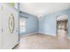 Open entryway featuring tile flooring, a chandelier, and a glimpse into the connected living spaces at 9644 Myrtle Creek Ln, Orlando, FL 32832