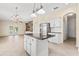 Kitchen with a center island and white cabinets at 9644 Myrtle Creek Ln, Orlando, FL 32832
