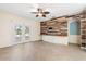 Living room features wood accent wall and sliding glass doors to the back yard at 9644 Myrtle Creek Ln, Orlando, FL 32832