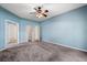 Main bedroom offering a ceiling fan and carpet flooring at 9644 Myrtle Creek Ln, Orlando, FL 32832