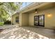 Covered back patio with ceiling fan overlooking the back yard at 9644 Myrtle Creek Ln, Orlando, FL 32832