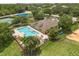 Aerial view of community pool, playground, and tennis courts at 9644 Myrtle Creek Ln, Orlando, FL 32832