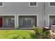 Backyard featuring a patio area, well-manicured lawn, and lush landscaping for outdoor living at 10914 Savannah Wood Dr # 139, Orlando, FL 32832